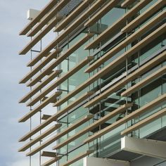 a tall building with lots of windows and balconies