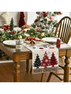 the table is set for christmas with plates and cups on it