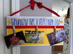 a family photo hanging on a bulletin board with magnets attached to the pegs