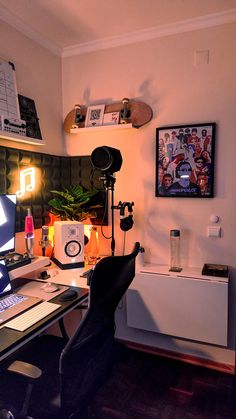 a desk with a laptop computer sitting on top of it