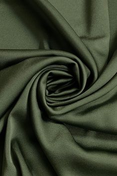 Distinguished by its luxurious design, our high-quality Triacetate Satin Backed Crepe in Olive fabric is perfect for evening wear, skirts, blouses, pants, shirts, jackets. Originally made in Japan, this exceptionally versatile fabric is the perfect choice for your next projects. Our unique and distinctive fabric is available in a wide selection of colors. Purchase high-quality Triacetate Satin Backed Crepe fabric by the Yard at NY Designer Fabrics. Elegant Silk Fabric For Evening, Elegant Silk Fabric For Formal Occasion, Elegant Evening Silk Fabric, Elegant Silk Fabric With Satin Finish, Olive Fabric, Luxurious Design, Fashion Attire, Satin Blouse, Crepe Fabric