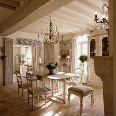 an image of a dining room table and chairs in the middle of a living room