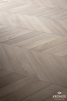 an image of wood flooring that looks like chevron herringbones in grey tones