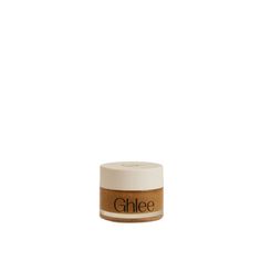 an open jar of ghlee cream on a white background with the word ghlee in it