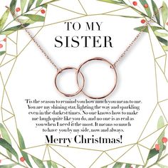 a christmas card with two rings on it and the words merry christmas to my mom