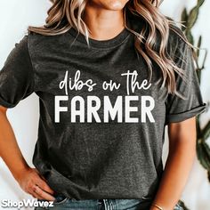 Dibs on the Farmer Shirt - With over 29,000 sales and 4,000 reviews, we have experience in printing quality t-shirts. Our apparel is everything you've wanted in a quality product. It feels soft and comfortable made from ring-spun cotton. Some colors also contain polyester. It's comfy and flattering for both men and women.  ✔️WHY CHOOSE US? * Quality t-shirts and print   * Over 4,000 reviews! * Many color and size options. Tank tops, hoodies, sweatshirts also available at customer request ✔️SIZIN Farmer Shirts For Women, Farmer Tshirt Ideas, Agriculture Tshirts, Support Farmers Shirt, Agriculture Shirt, Southern Shirt, Farmer Wife, Gifts For Farmers