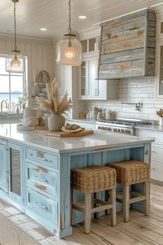 a kitchen island with two stools in front of it and an open floor plan