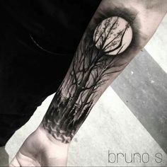 a man with a tree tattoo on his arm