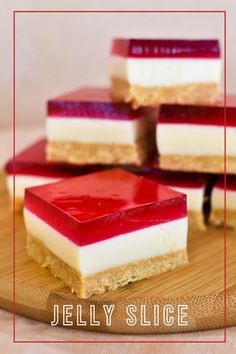 four pieces of jelly slice sitting on top of a wooden cutting board