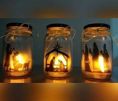 three mason jars with nativity scene in them