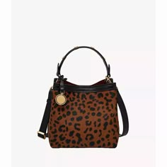 This stylish Jessie Bucket Bag, our take on the iconic bucket silhouette, is outfitted in leopard-print haircalf leather. Signature design elements such as our engravable Legacy Charm and rivets with subtle knurled texture lend an elevated-meets-everyday style. Wear as a top handle or a crossbody with its detachable leather strap. Fossil leather products support responsible manufacturing via the Leather Working Group. Leopard Purse, Unique Handbag, Baked Cod, Womens Trendy Dresses, Small Buckets, Cute Colors, Perfect Handbag, Purses For Women, Fossil Bags