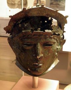 an ancient head on display in a museum