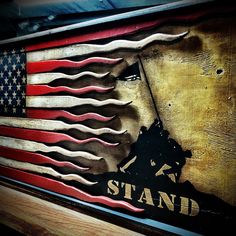 an american flag with the words stand on it