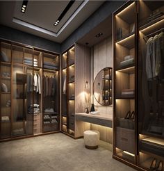 a large walk in closet with lots of clothes