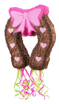 a pair of pink and brown knitted gloves with hearts on them, attached to a string