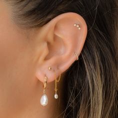 These mini hoops are one of our best-sellers for a reason! These classic hoops upgrade any look. They also have cool 2-in-1 feature, the pearl can be taken off for when you want to rock the hoops alone (simply slide the pearl off of the hoop). Measurements: 13mm x 2mm 14k Gold-filled Freshwater pearls vary in size/shape/color Everyday Teardrop Huggie Earrings With Pearl Drop, Everyday Teardrop Baroque Pearl Earrings, Dainty Huggie Earrings With Pearl Charm For Everyday, Classic Everyday Pearl Chain Earrings, Classic Pearl Huggie Earrings For Everyday, Dainty Pearl Pendant Earrings For Everyday, Classic Pearl Earrings With Pearl Chain For Everyday, Dainty Everyday Pearl Pendant Earrings, Teardrop Baroque Pearl Earrings For Everyday