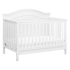 a white crib with no mattress in it