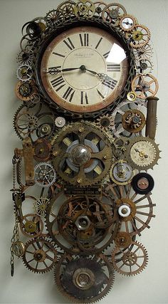 an old clock with gears attached to it