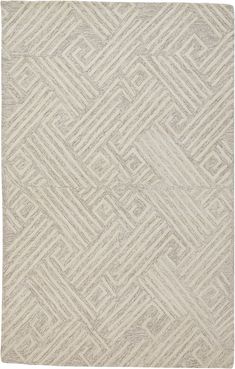 a white rug with an intricate design on the front and back side, in shades of grey