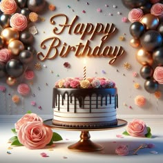 a birthday cake sitting on top of a table next to balloons and confetti