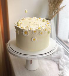 a white cake sitting on top of a table