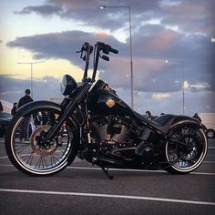 a black motorcycle parked in a parking lot