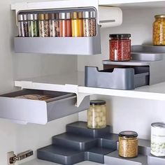 the shelves are filled with various containers and food items in each container, including canned beans