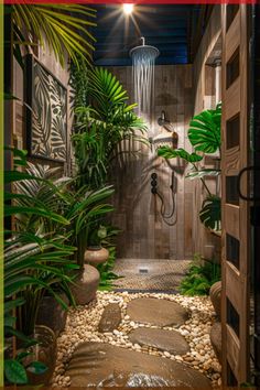 an outdoor shower surrounded by plants and rocks in a tropical setting with text overlay