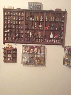 there are many shelves on the wall with figurines