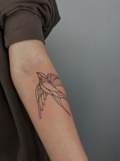 a person with a tattoo on their arm