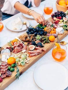 a table topped with plates and bowls filled with food