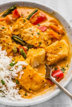 a white bowl filled with chicken and rice