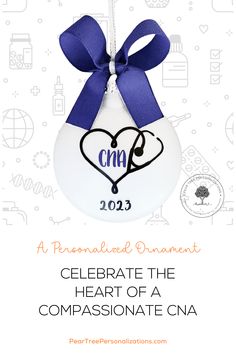 a white ornament with a blue ribbon and a heart in the center that says,