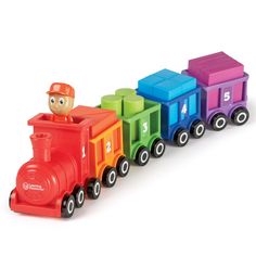 a colorful toy train with a little boy riding on it's engine and number