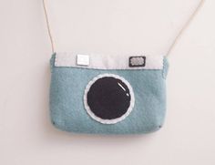 Sky blue mini camera shaped handbag / purse for kids and toddlers. The dimensions of the purse are 5 x 4 x 1.  Adjustable felt bag handle and magnetic snap inside. Toddler Purse, Felt Hair Clips, Butterfly Hair Clip, Yellow Heart, Mini Camera, Butterfly Hair, Felt Bag, Bag Handle, Flower Hair Clips