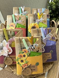 a basket filled with lots of different types of cards and tags on top of a wooden table