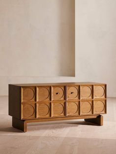 the sideboard is made out of wood and has eight drawers on each side,