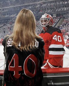 the hockey players are waiting for their turn to play