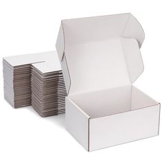 a white box filled with lots of brown paper plates on top of eachother