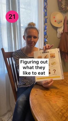 a woman sitting at a table with a book in front of her and the caption saying, figuring out what they like to eat