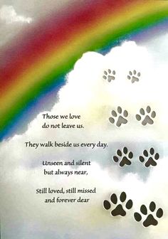 a rainbow and paw prints with the words those we love don't leave us they walk beside us every day