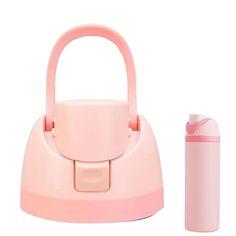 a pink portable tea kettle next to a cup