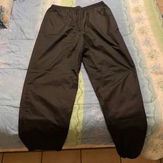 Never Worn Excellent Condition Windbreaker Pants Style Full Length Sports Pants With Elastic Waistband, Sports Bottoms With Side Pockets, Black Moisture-wicking Sportswear Bottoms, Sports Trousers With Elastic Waistband, Black Sports Bottoms Long Pants, Black Sports Long Pants, Black Jogging Pants With Side Pockets, Black Sweatpants With Side Pockets For Gym, Black Gym Pants With Side Pockets