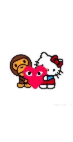 a hello kitty and monkey sticker sitting next to each other