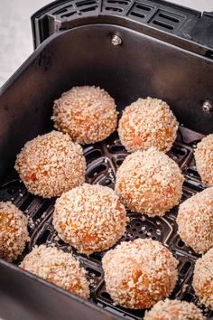 some food is being cooked in an air fryer with coconut sprinkled on top