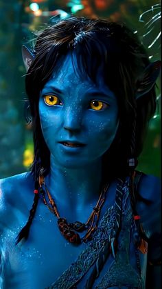 a woman with blue skin and yellow eyes is dressed up as avatar from the movie avatar