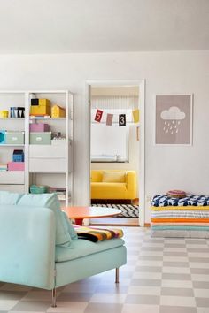 a living room filled with furniture and lots of bookshelves on top of it