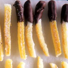 five pieces of chocolate and orange candy on a tray