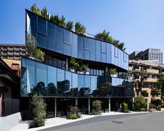 a large building with many windows and trees on the top of it's sides