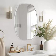 a bathroom sink with a mirror above it and soap dispensers on the counter